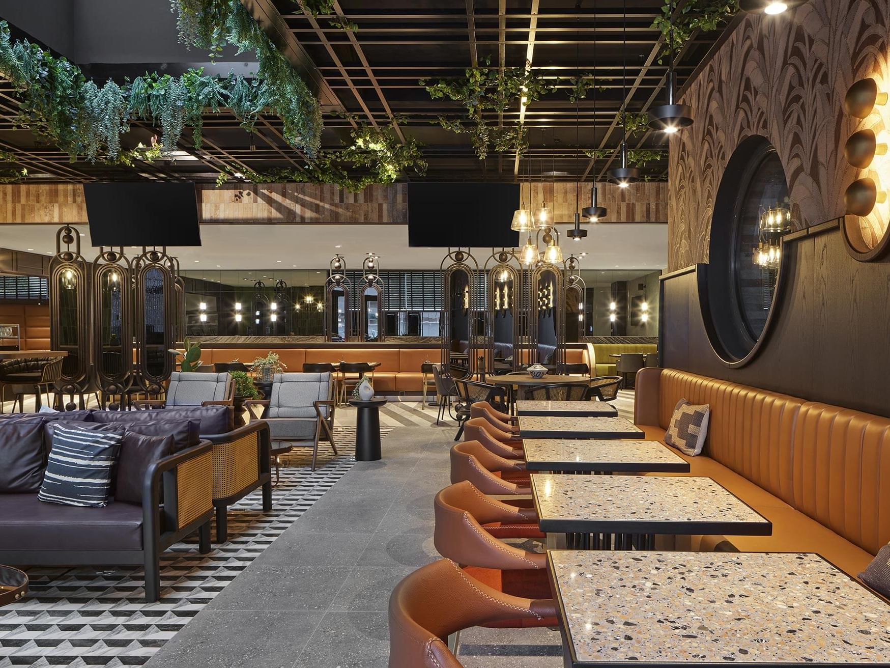 Cafe interior with plush seating and ornaments in Winter Garden at Titanic Comfort Kurfürstendamm