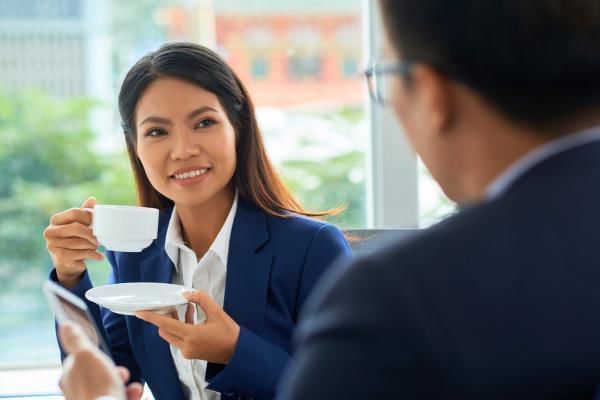 Business people having coffee lunch together