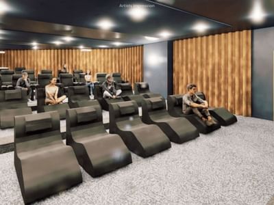 Comfortable lounge chairs in a cozy theater-style seating area at UniLodge Brisbane City.