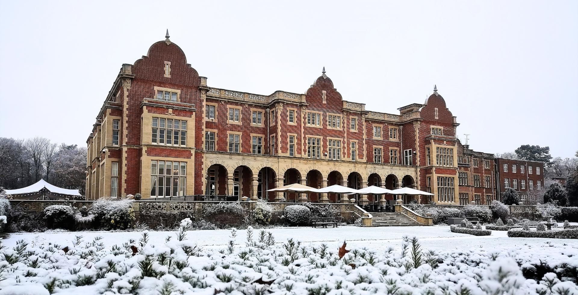 exterior rear shot of snowy easthampstead park in bracknell
