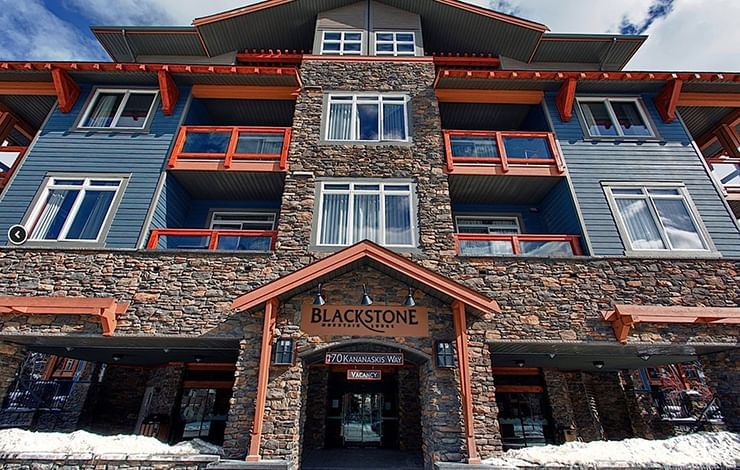 Low-angle exterior view of the lodge with entrance to the Blackstone Mountain Lodge