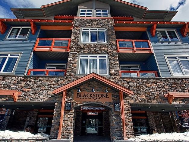 Low-angle exterior view of the lodge with entrance to the Blackstone Mountain Lodge