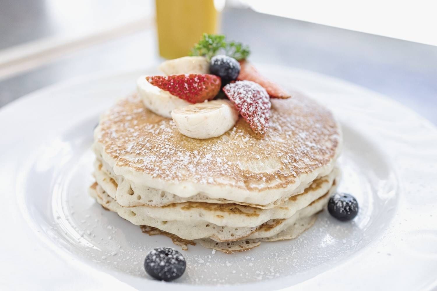 Close-up of a Pan Cake dish served with berries in Ilima Cafe at Waikiki Resort Hotel