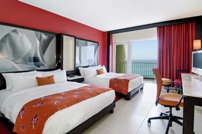 Twin Beds with furniture in a room at The Condado Plaza Hilton