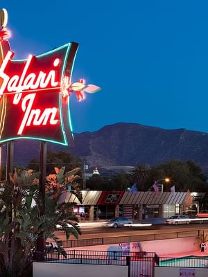 Exterior of Safari Inn, a Coast Hotel at night