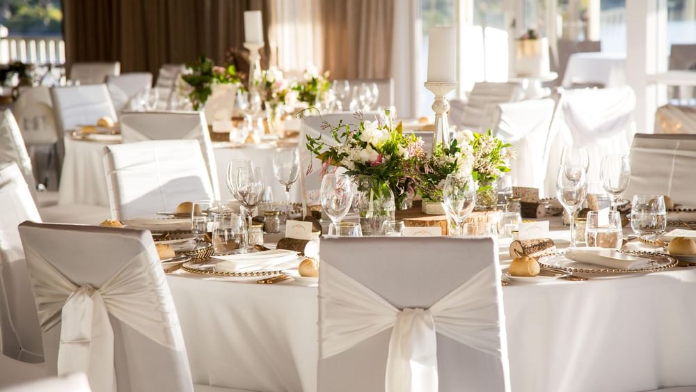 Elegant dining setup with glassware and floral centerpieces at Lily’s on the Lagoon at Novotel Sunshine Coast Resort