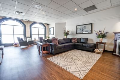 Lounge area with cozy sofa set-up & wooden floors at Temple Gardens Hotel & Spa