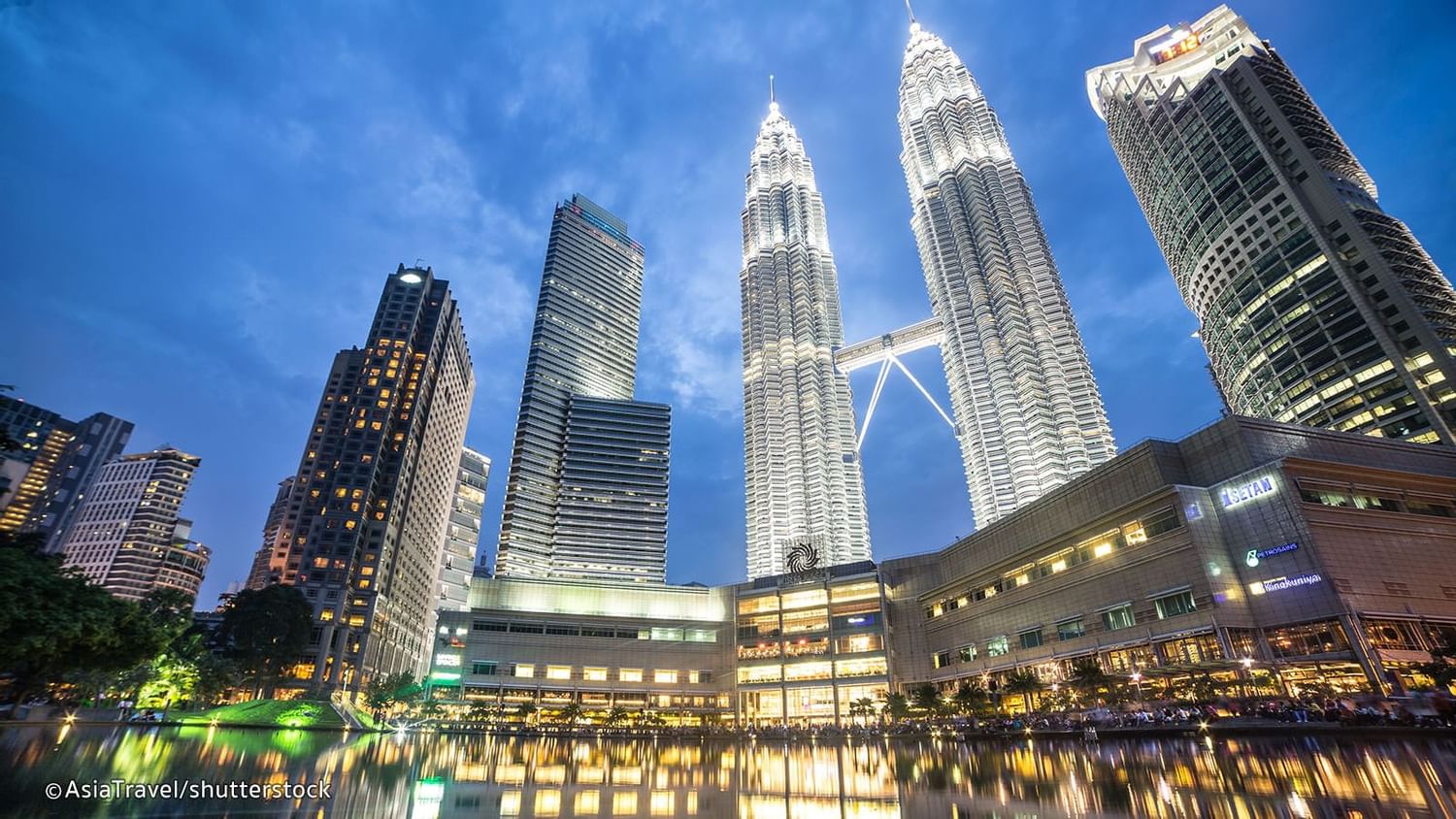 Low angle view of the Petronas Twin Towers at night near The Banjaran Hotsprings Retreat