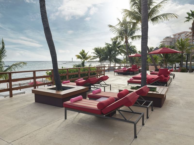 Outdoor lounge area with a Sea view at Grand Fiesta Americana