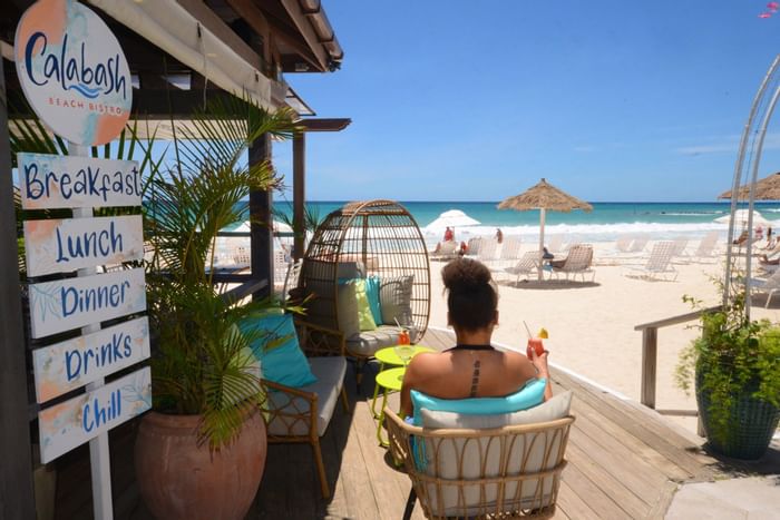 Woman by the Calabash Beach Bistro at Bougainvillea Barbados