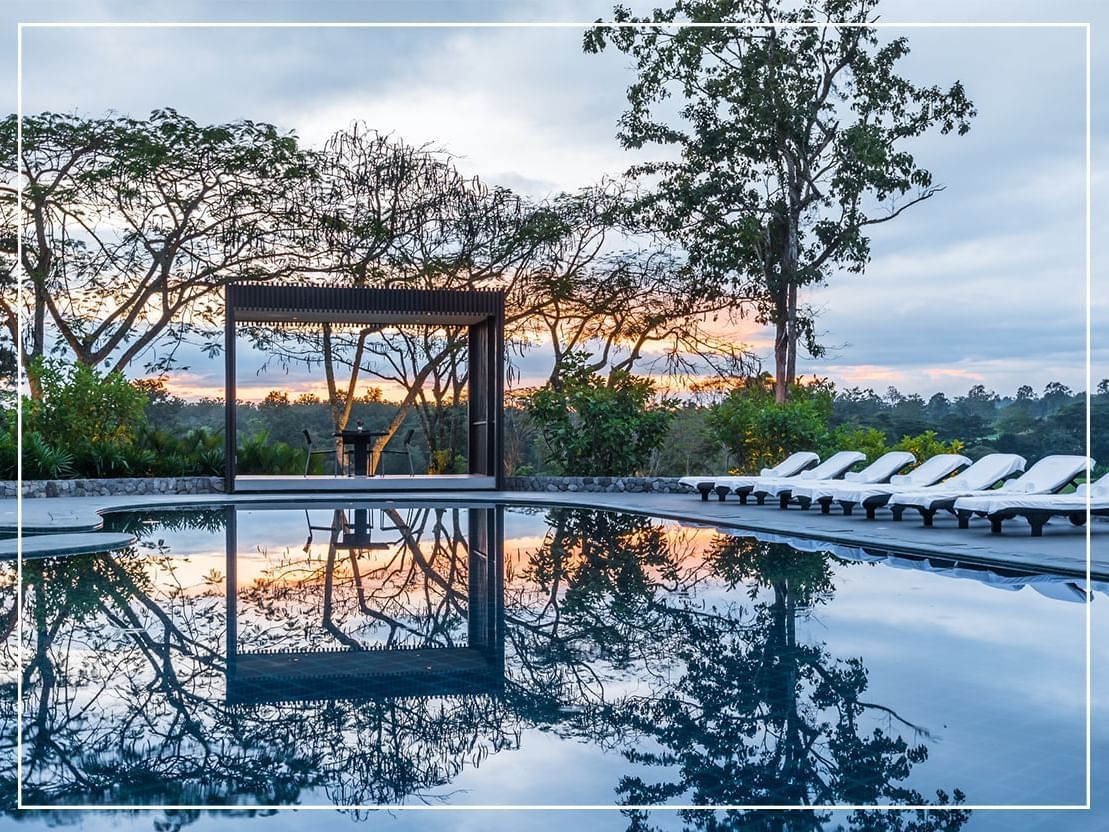 Outdoor pool with sitting area in Chatrium Golf Resort Soi Dao Chanthaburi