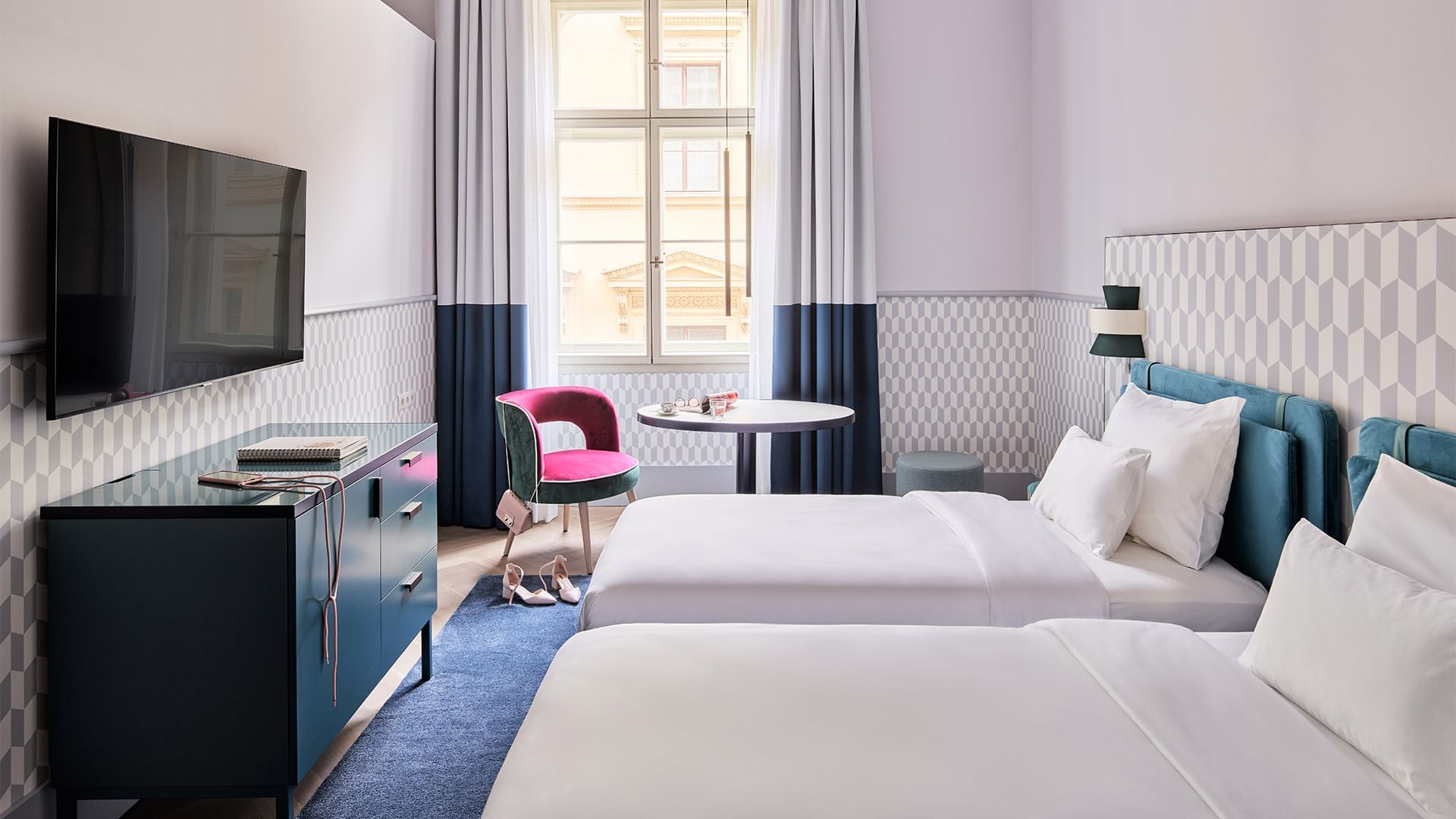 Two beds & TV in Double Room at Falkensteiner Hotels