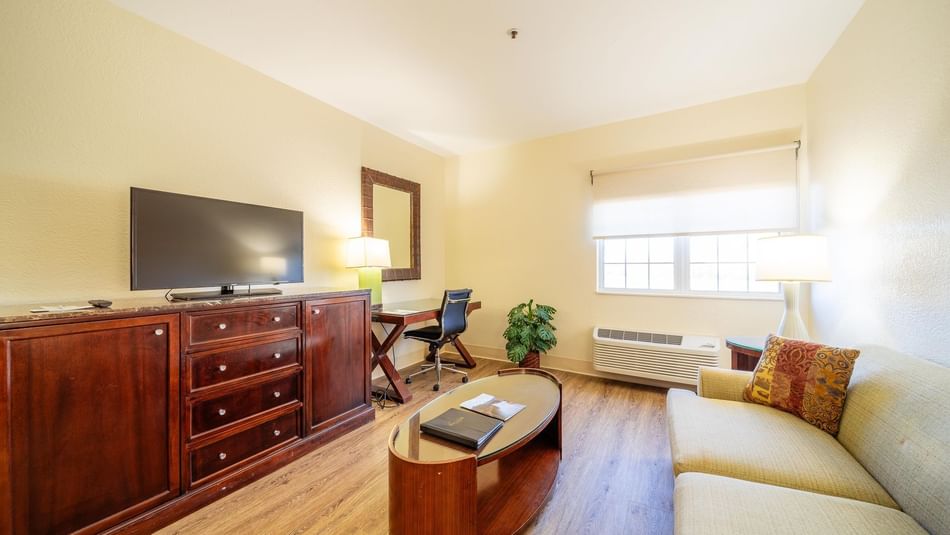 TV lounge area with workspace in Suite Room at South Branch Inn Moorefield