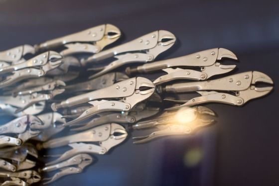 School of Fish artwork made with steel self grip wrenches at Retro Suites Hotel