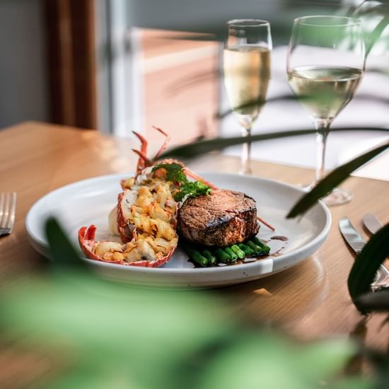 Steak & lobster dish in Coco's Kitchen + Bar at Pullman Cairns