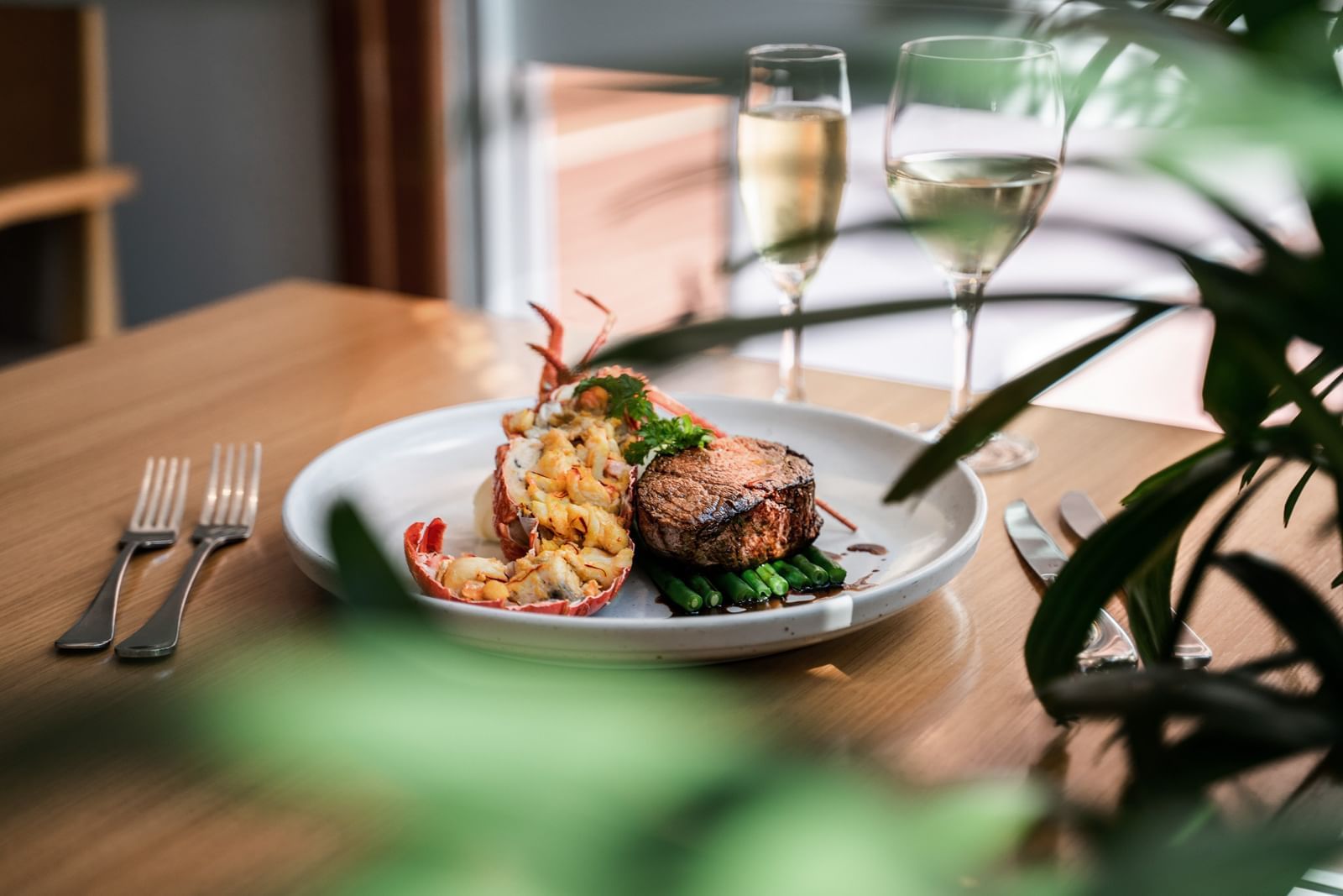 Steak, lobster dish & wine in Coco's Kitchen at Pullman Cairns