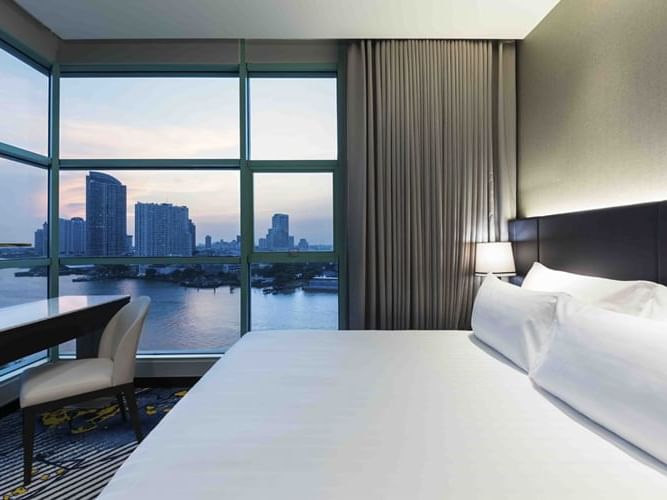 Interior of a bedroom in Chatrium Hotel Riverside Bangkok