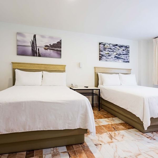 Twin comfy beds in Executive Room at Gamma Hotels