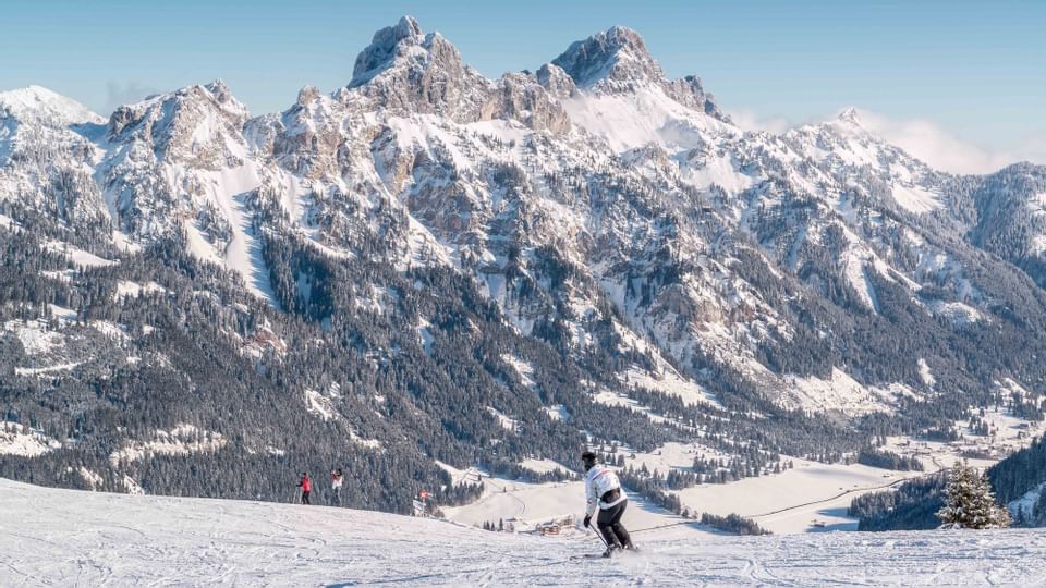 Long shot of a skier on a snowy mountain near Liebes Rot