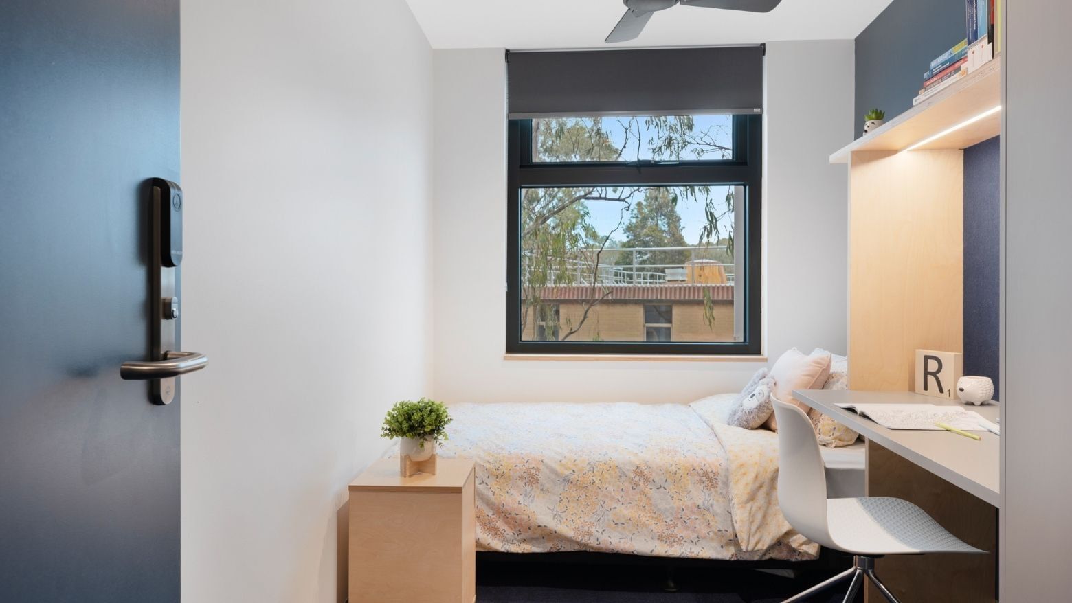 La Trobe University - North and South Apartments bedroom with desk and window view.