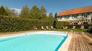 Outdoor pool with sunbeds at Auberge La Tomette
