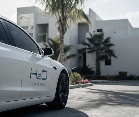 Tesla rental car parked outdoors at H2O Life Style Resort