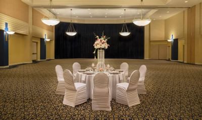 Beautiful ballroom with table and chairs