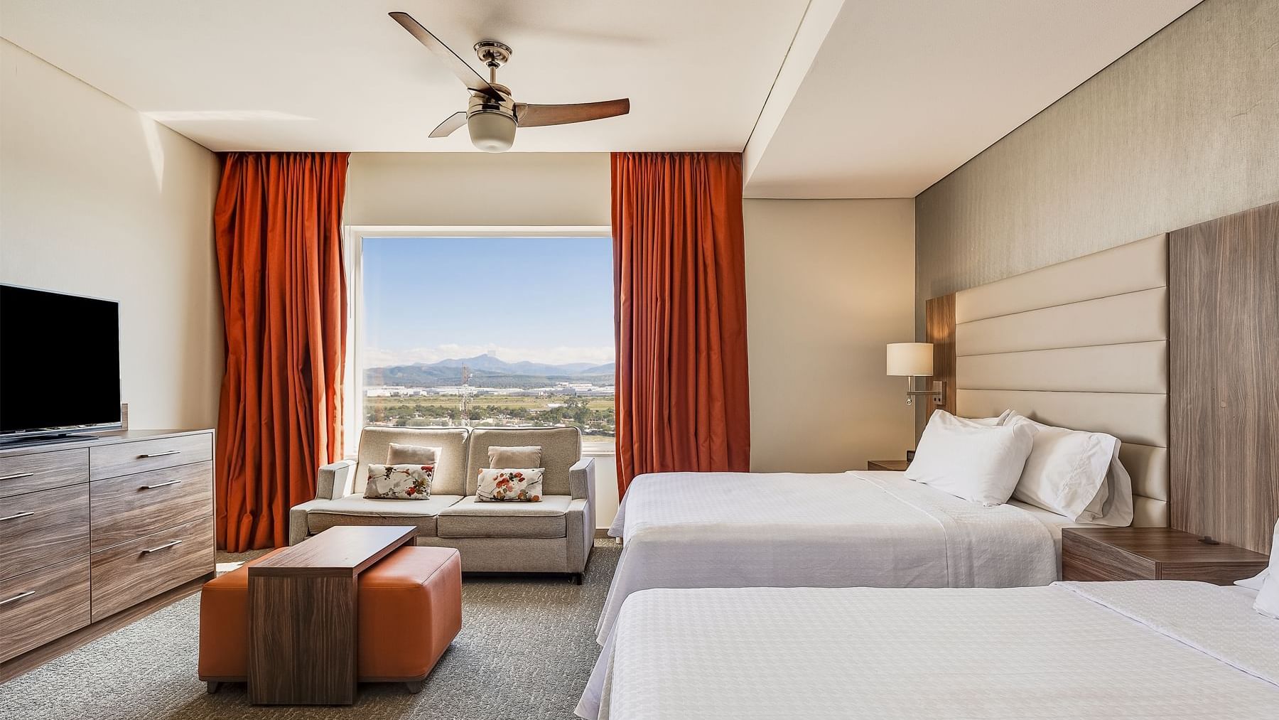 Two Queen-sized beds in Suite Matrimoniales at Fiesta Inn Suites Aeropuerto del Bajío Silao
