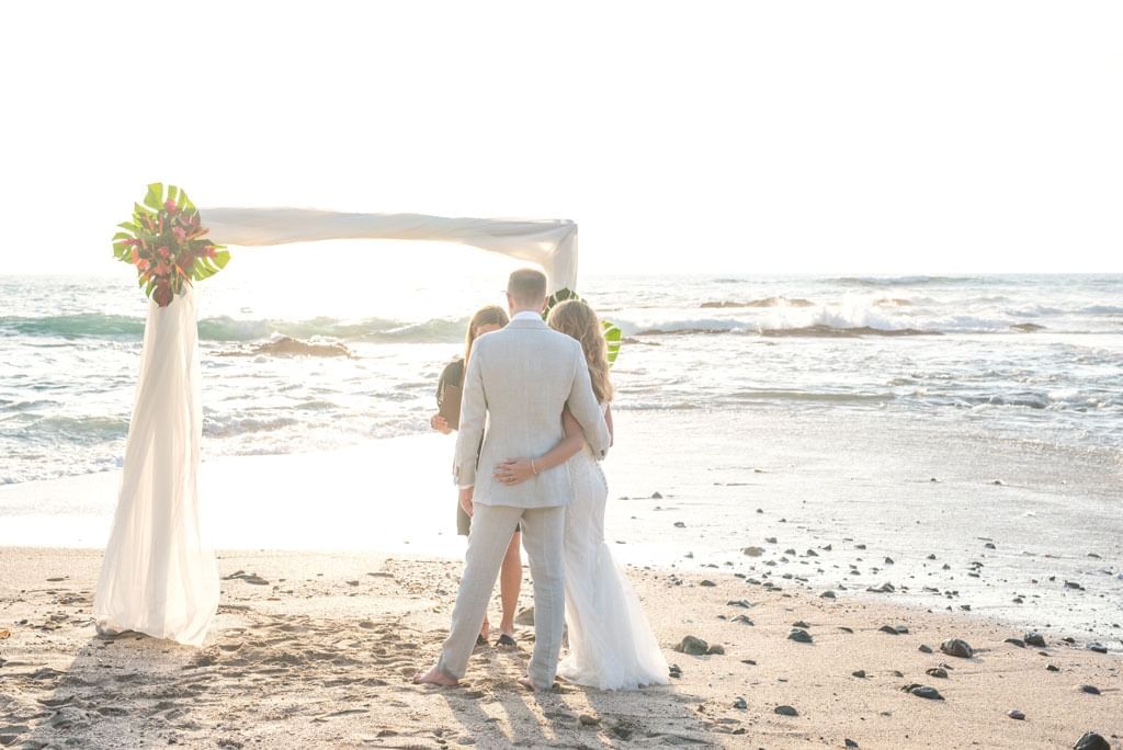 couple getting marry at the beach