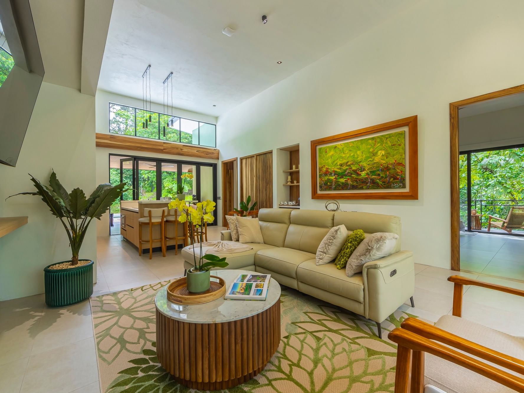 Living room with couch and decor in Villa Kioro at Arenal Kioro Suites & Spa in La Fortuna.
