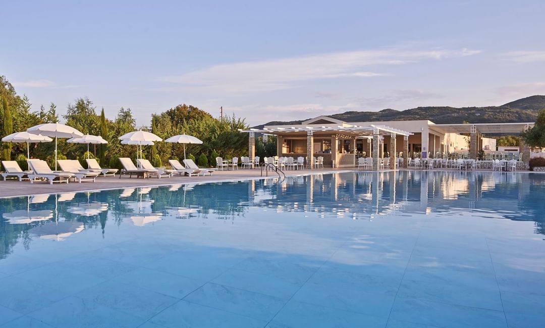 Closeup on the pool with pool chairs at Kairaba Hotel