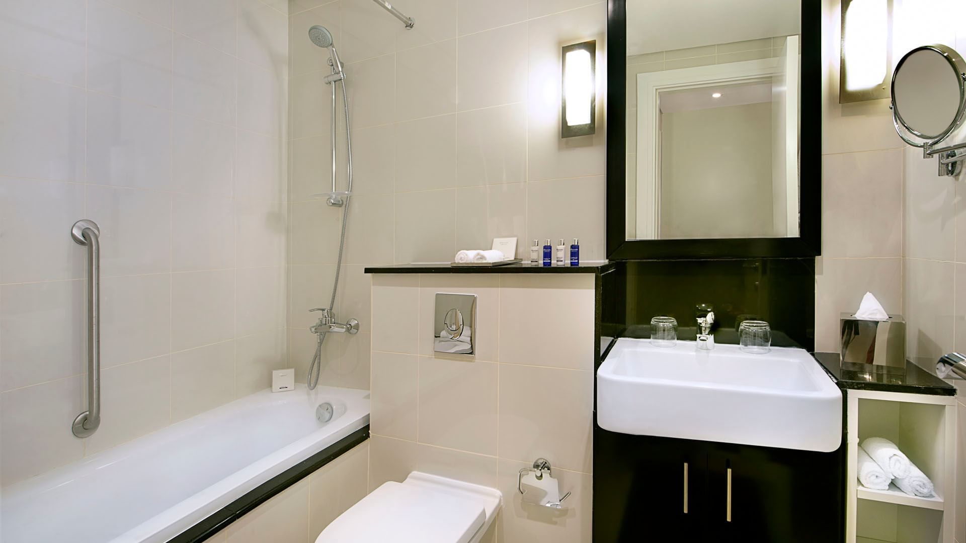 Bathroom Vanity & bathtub in One Bedroom Suite suite at DAMAC Maison Cour Jardin