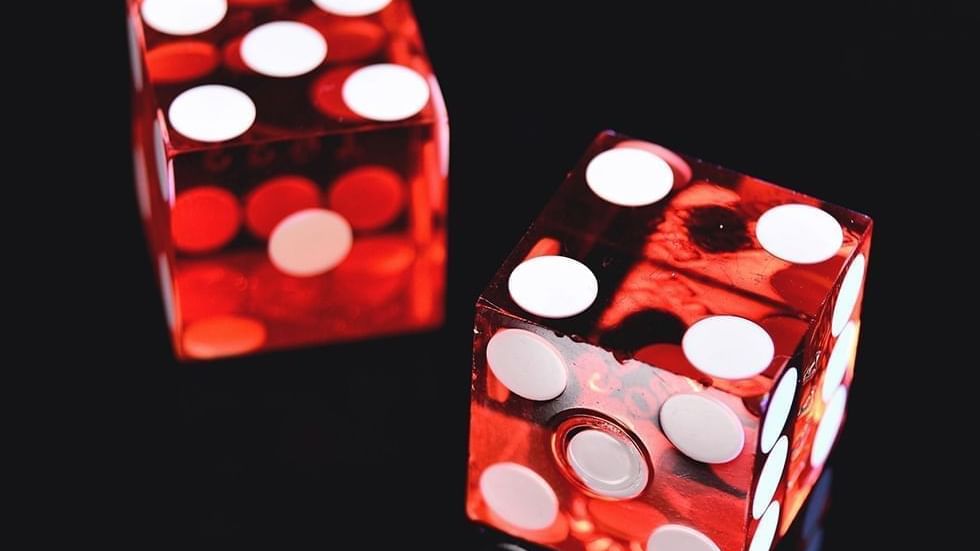 Two translucent red dice with white dots at Falkensteiner Hotel Belgrade