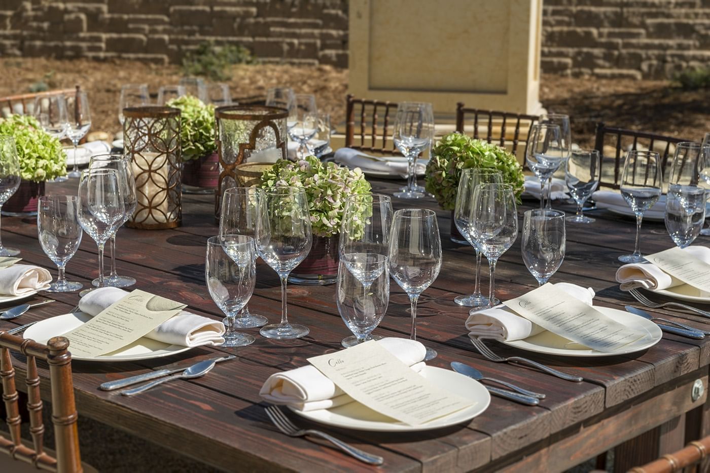 Outdoor wooden table prepared for dining 