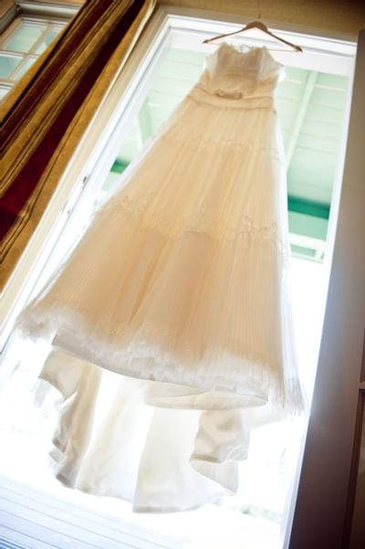 Wedding dress hanging on window