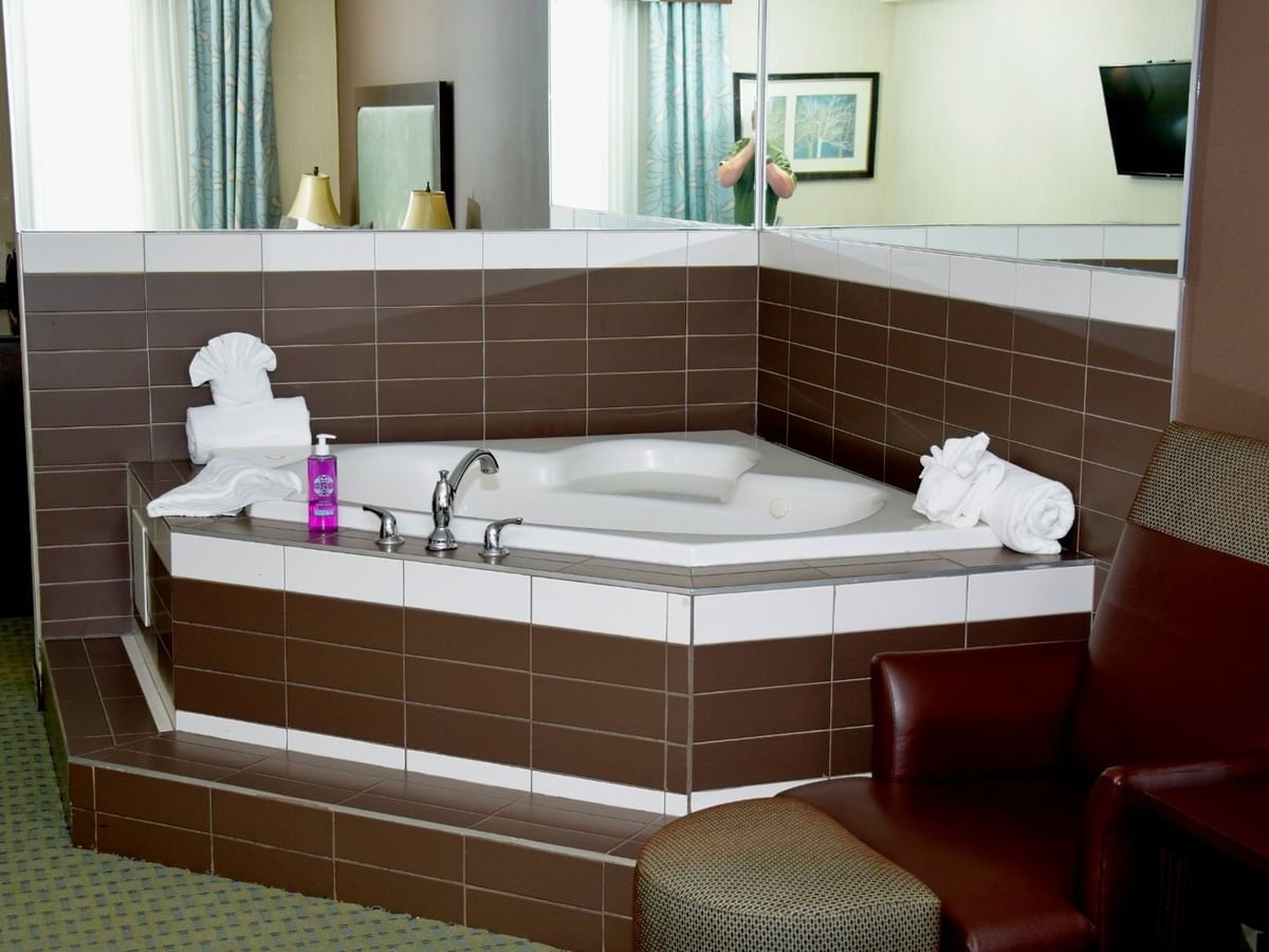 A hotel room with jetted tub