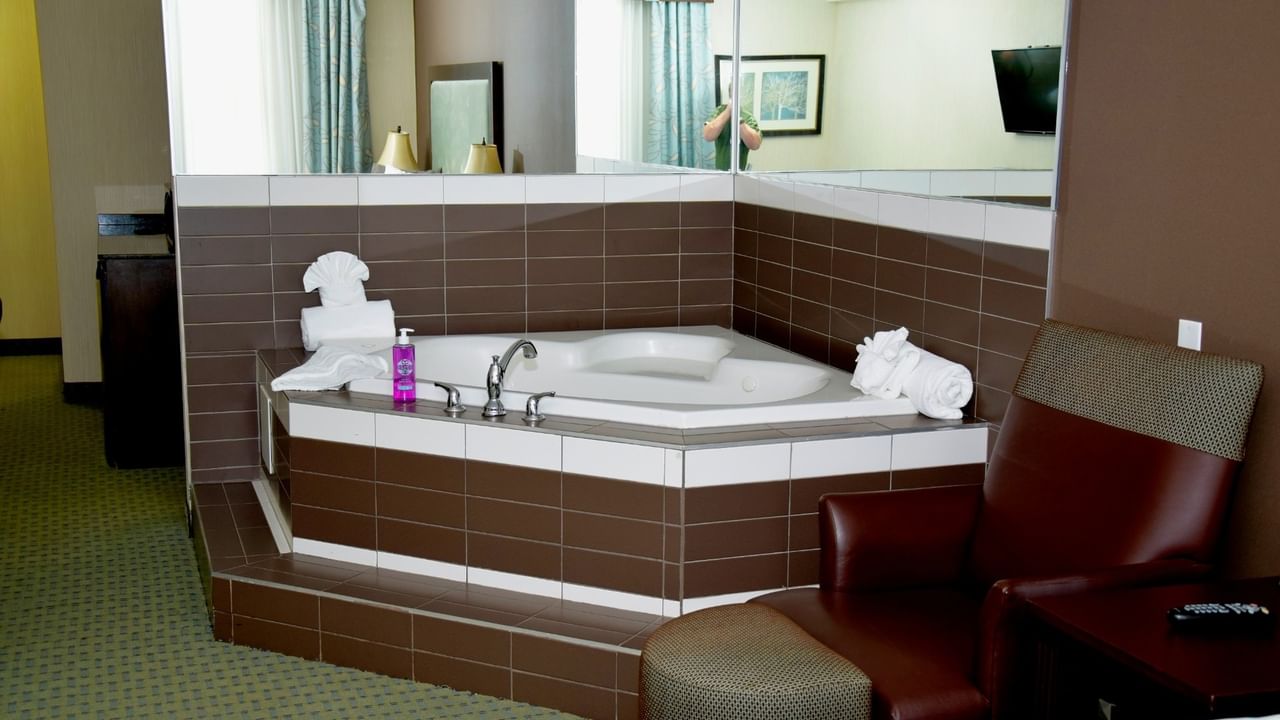 A hotel room with jetted tub
