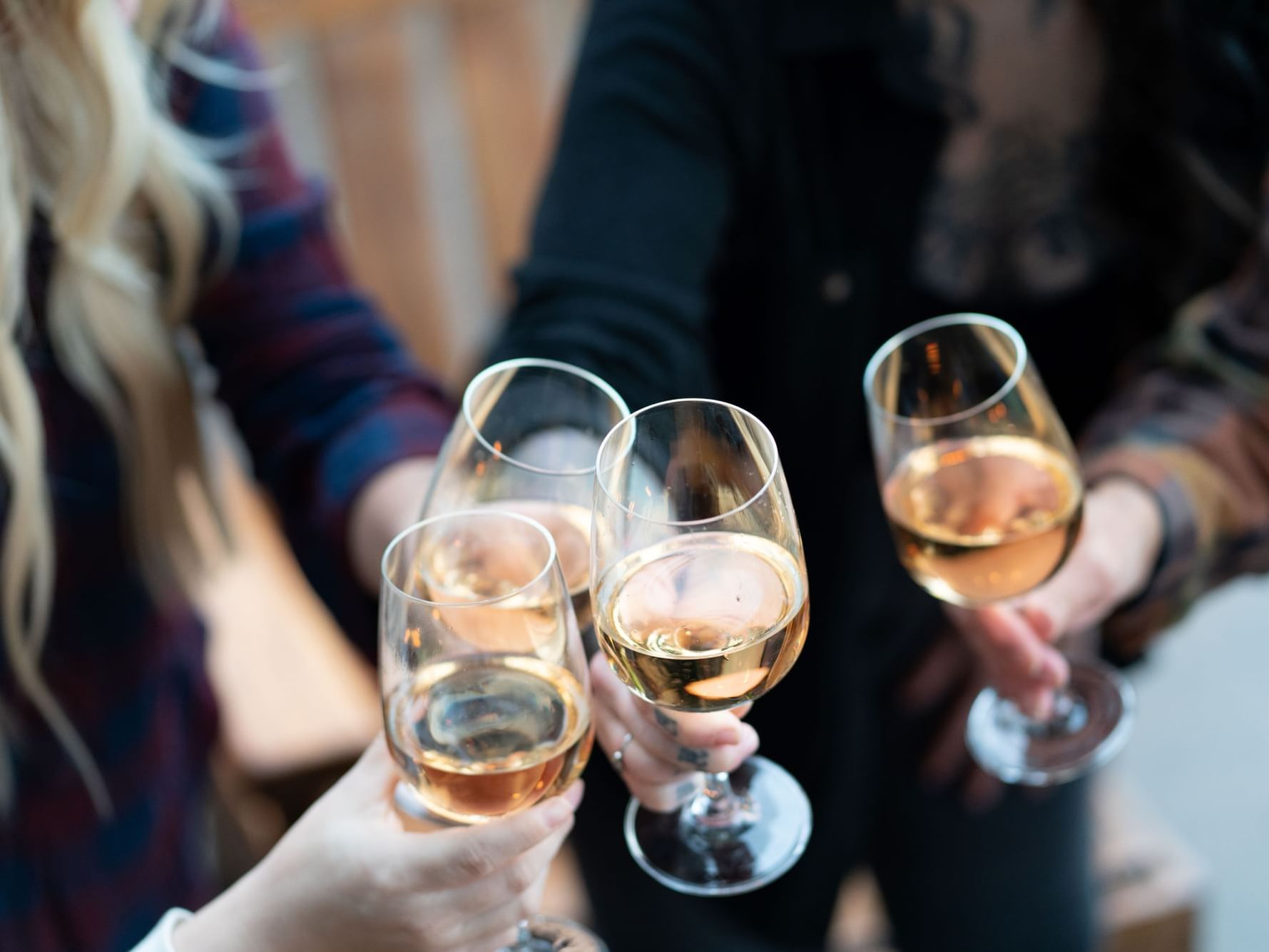 Group of people toasting their champagne glasses at Alderbrook Resort & Spa