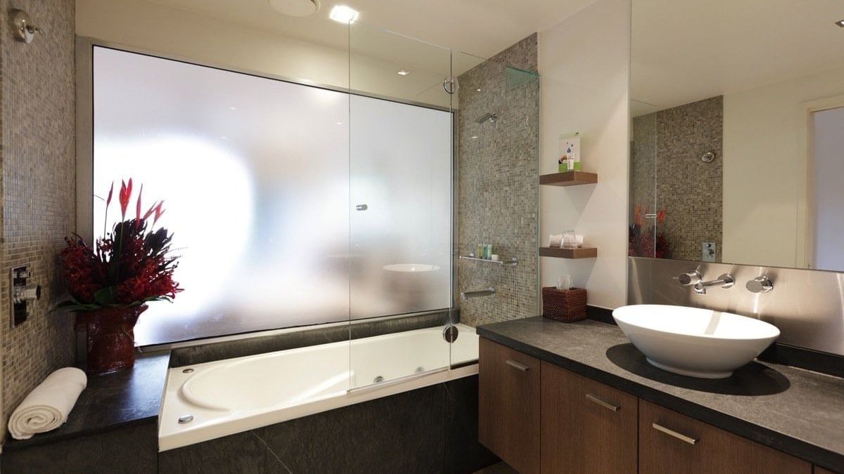 Bathroom in rooms at Pullman Palm Cove Sea Temple Resort & Spa