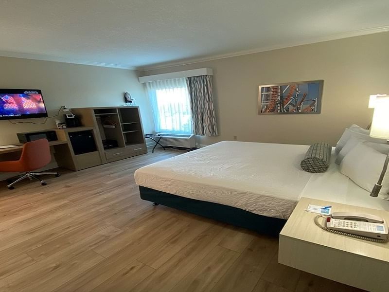 Bedroom in ADA king room accessible at Galleria Palms Hotel