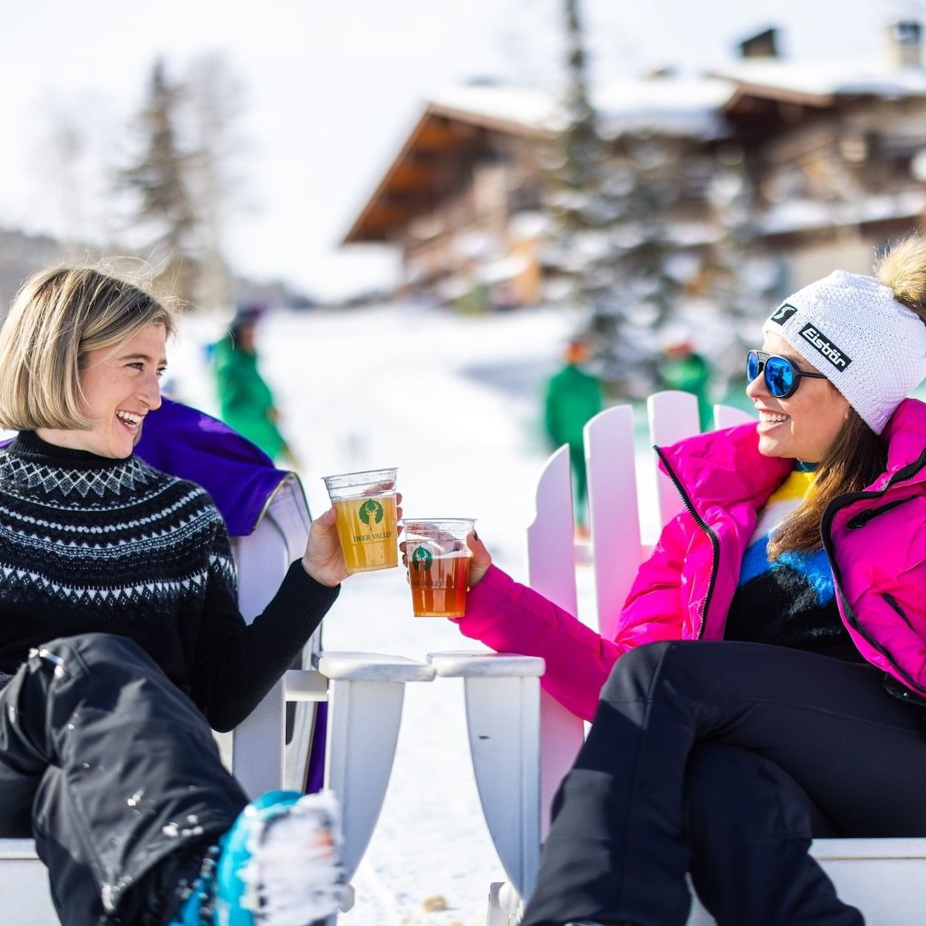 Friends with beers on a bluebird ski day