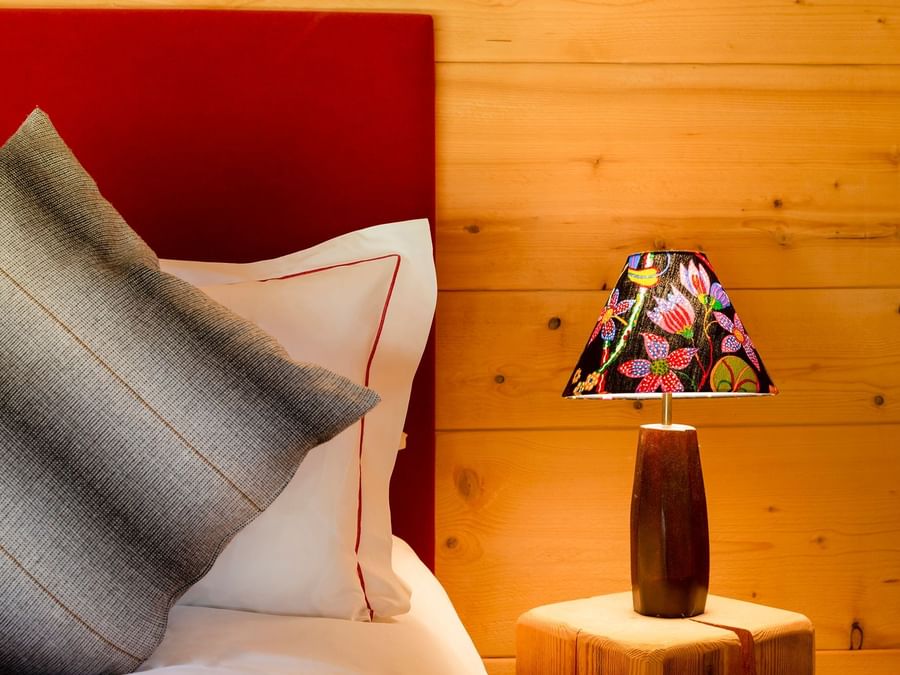 Closeup of a pillow on a bed at Chalet-Hotel La Ferme du Chozal