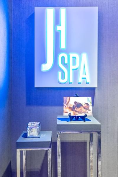 Signboard of J House Spa on a wall at J House Greenwich, CT hotel with contemporary design and spa