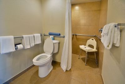 Lavatory and shower in ADA Room at Rosen Inn Closest to Universal