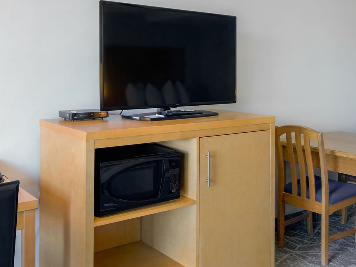 A TV and microwave in the room