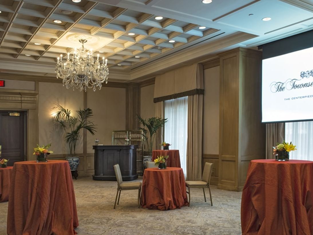 Tables & projector screen arranged in Salon I at Townsend Hotel