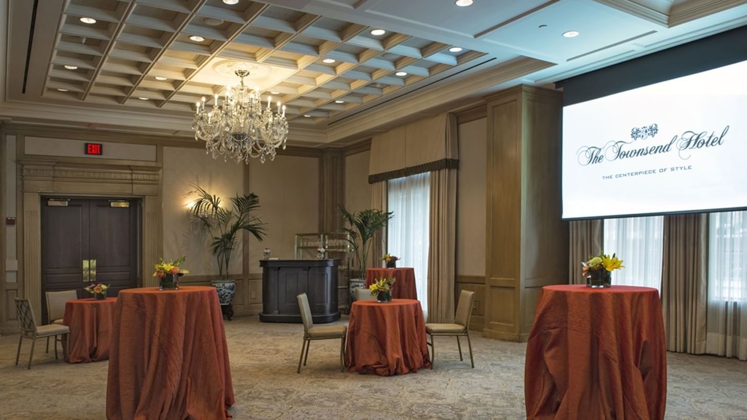 Tables & projector screen arranged in Salon I at Townsend Hotel