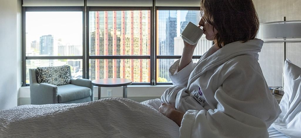 Guest in bed with coffee and Seattle view