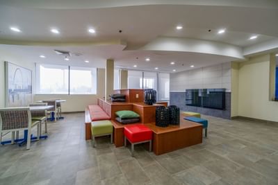 Colorful seating in hotel lounge area at St. Louis Airport Hotel