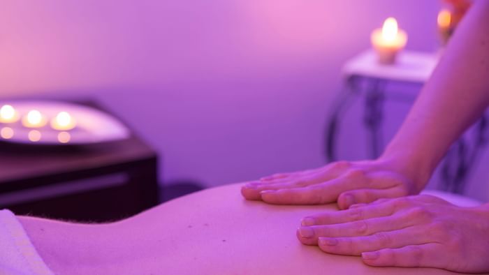 Masseur giving a body massage in a Spa at Hotel du Pont Roupt